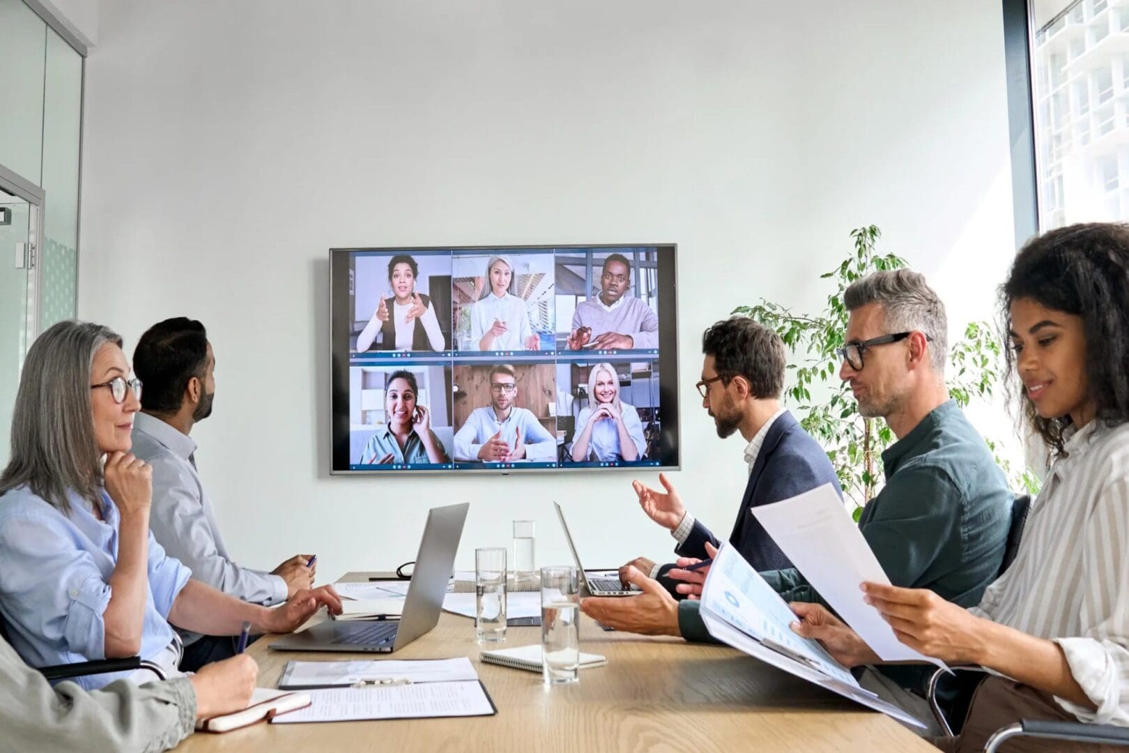A group of people sitting around a table.