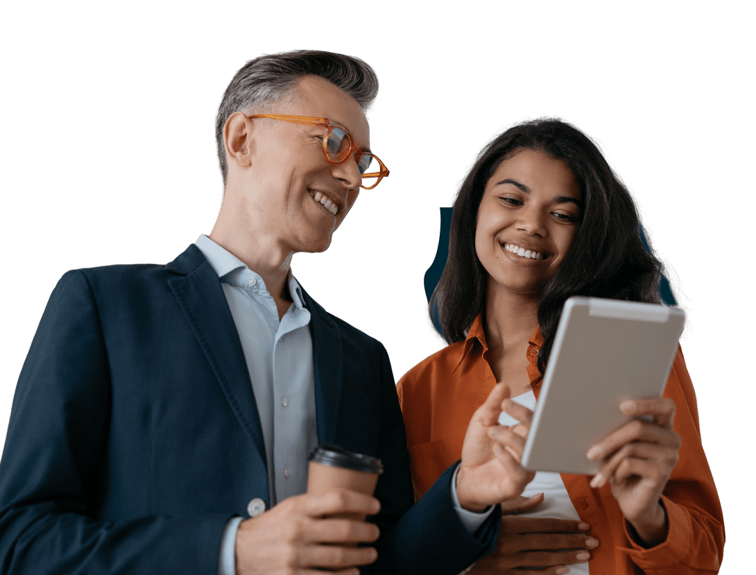 A man and woman looking at an ipad.