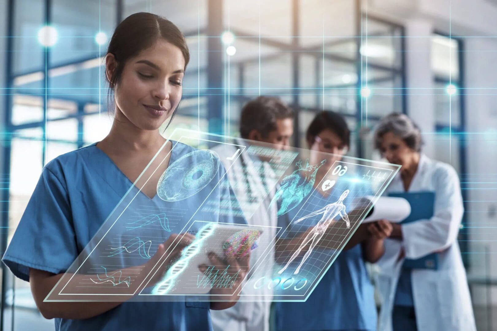 A group of people in scrubs looking at an ipad.